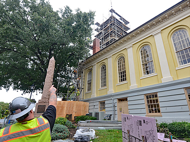 Scaffolding set up on an old courthouse clock tower in Warrenton, VA