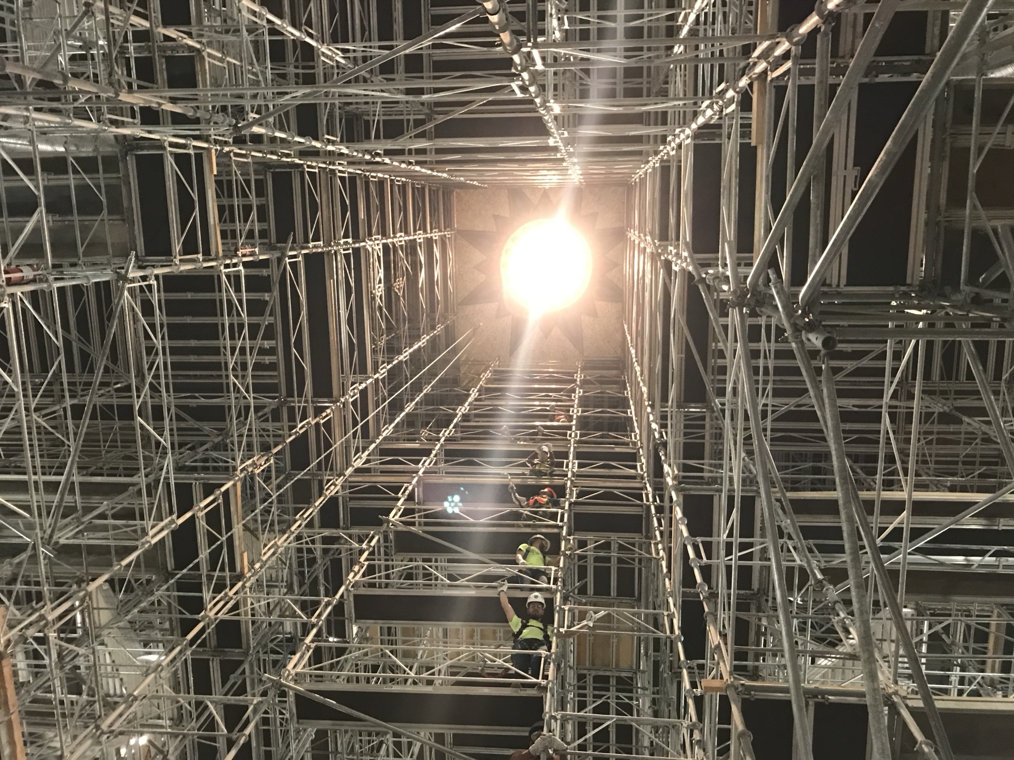 After the structure was inspected for scaffolding safety, workers begin their day with a burst of sunshine through the dome's oculus.
