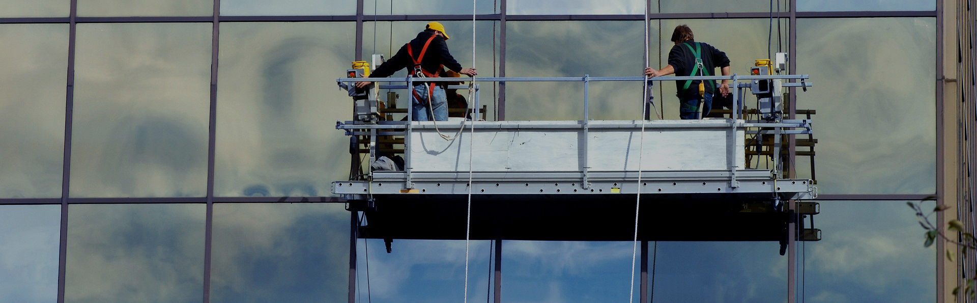 Suspended window washing scaffolding on a building