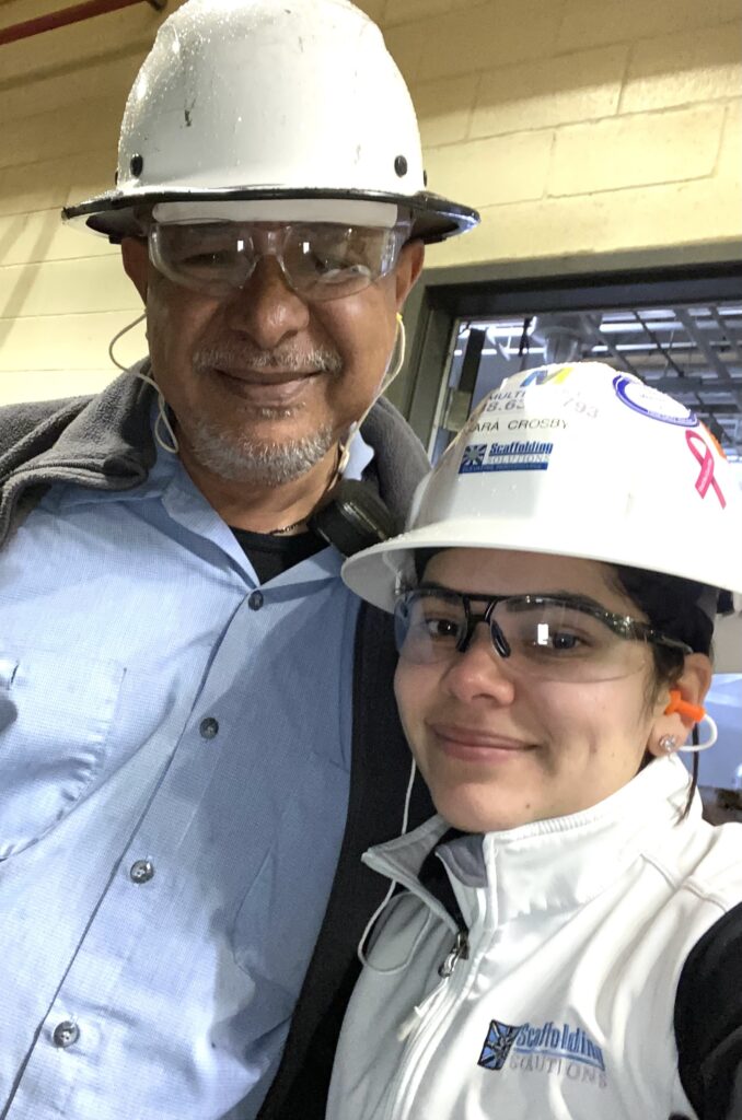 Two Scaffolding Solutions team members wearing hard hats