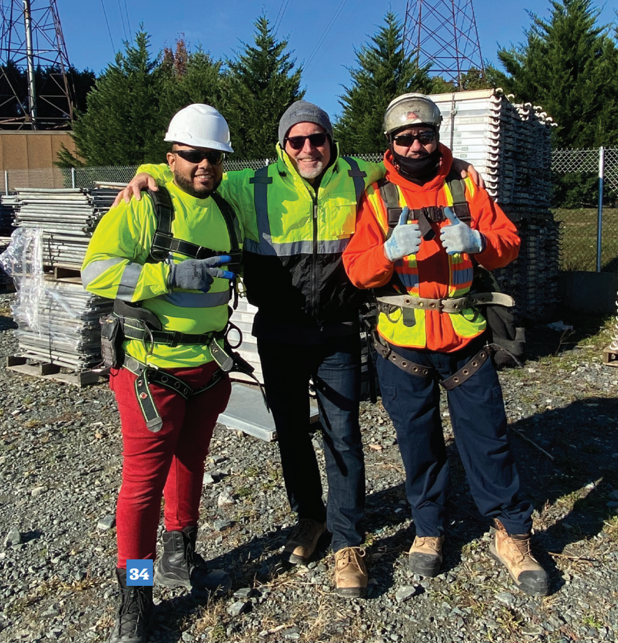 Three Scaffolding Solutions team members wearing safety gear