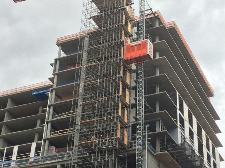 Scaffolding and a construction elevator installed at a construction site