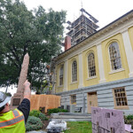 Scaffolding set up on an old courthouse clock tower in Warrenton, VA